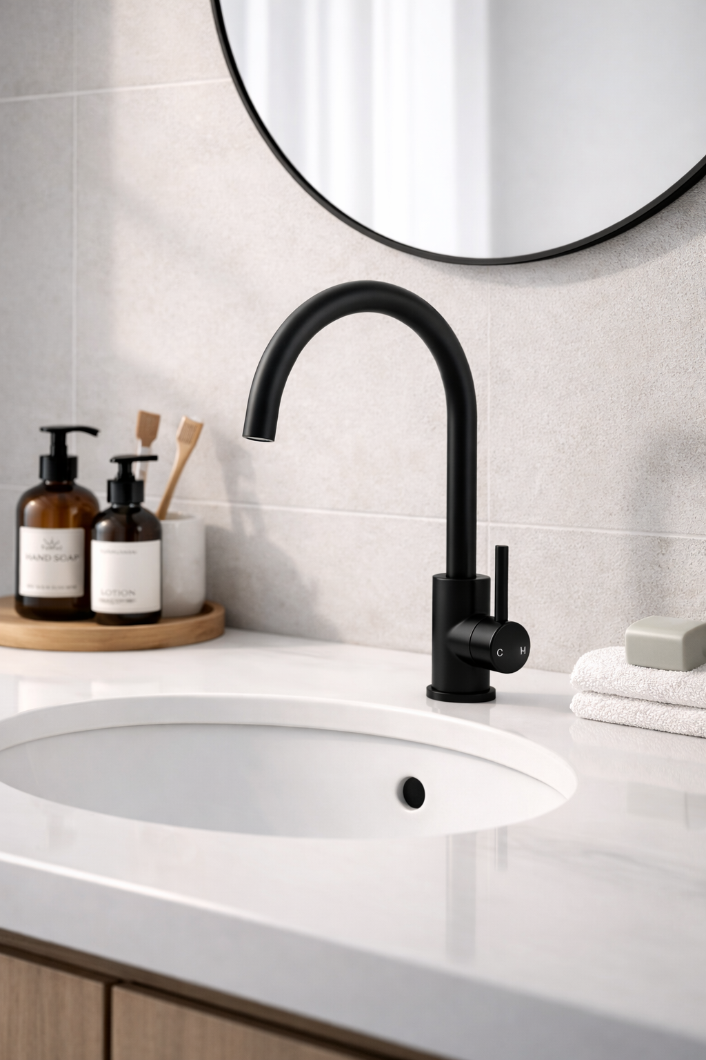 Platinum gooseneck sink mixer in black finish installed in a bathroom